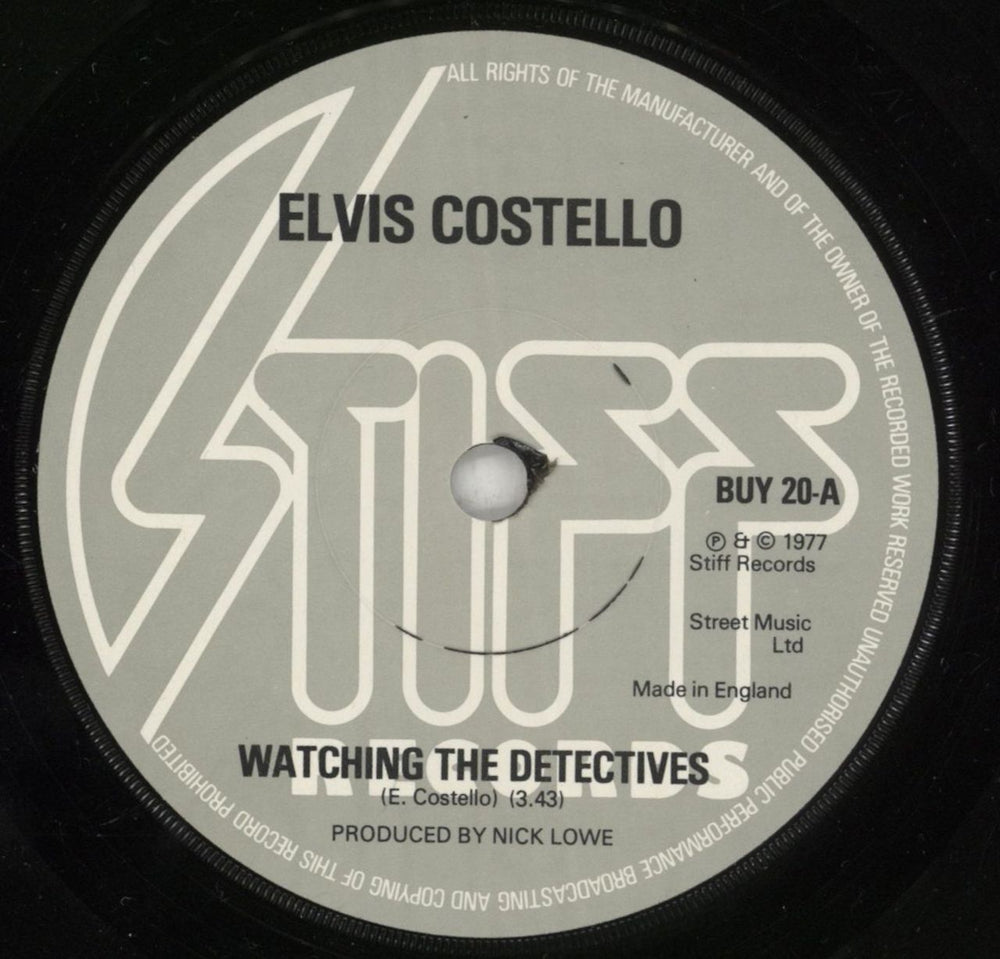 Elvis Costello Watching The Detectives - Solid + p/s UK 7" vinyl single (7 inch record / 45) COS07WA748604